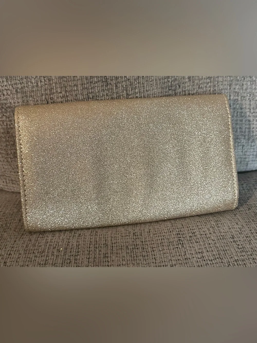 Used once. Gold Glitter Bow Chain Clutch